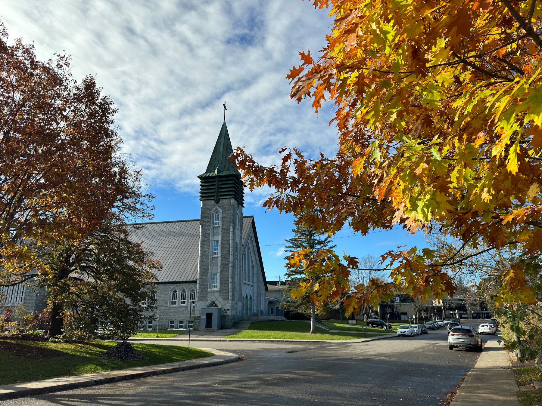 A neighbourhood church building surrounded by trees
