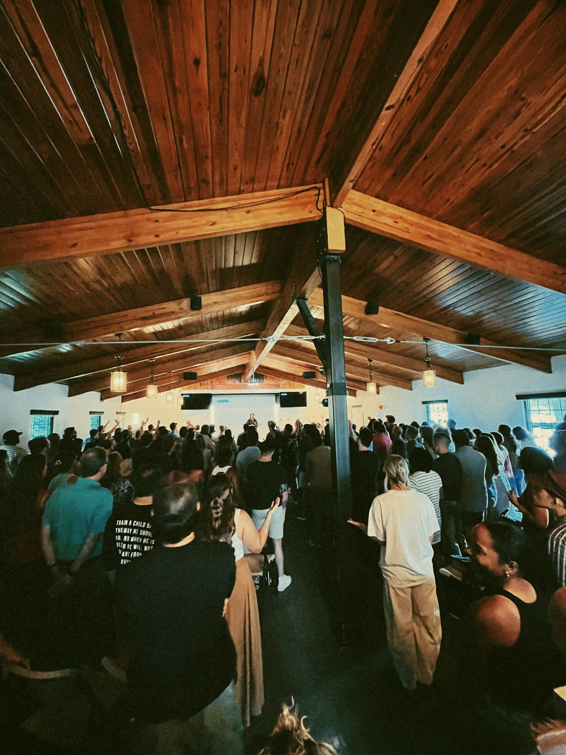A church network gathering in a warm wooden hall